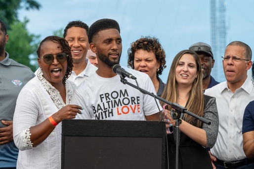 Mayor Brandon M. Scott at podium with people