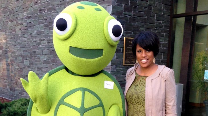 IMAGE: Mayor Rawlings-Blake poses with Turtle, mascot of the Growing Green Initiative